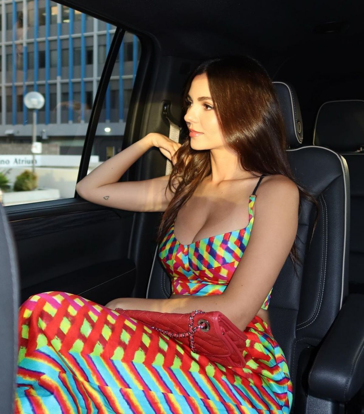 Victoria Justice sitting in a car, getting ready for the Paramount+ Zoey 102 premiere.