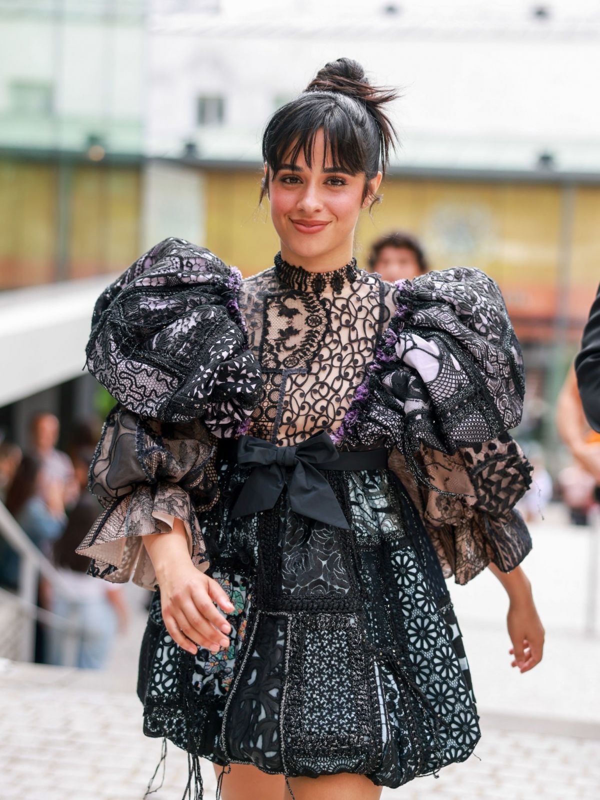 Camila Cabello Turns Heads in Black Frill Shoulder Dress at Paris Fashion Week