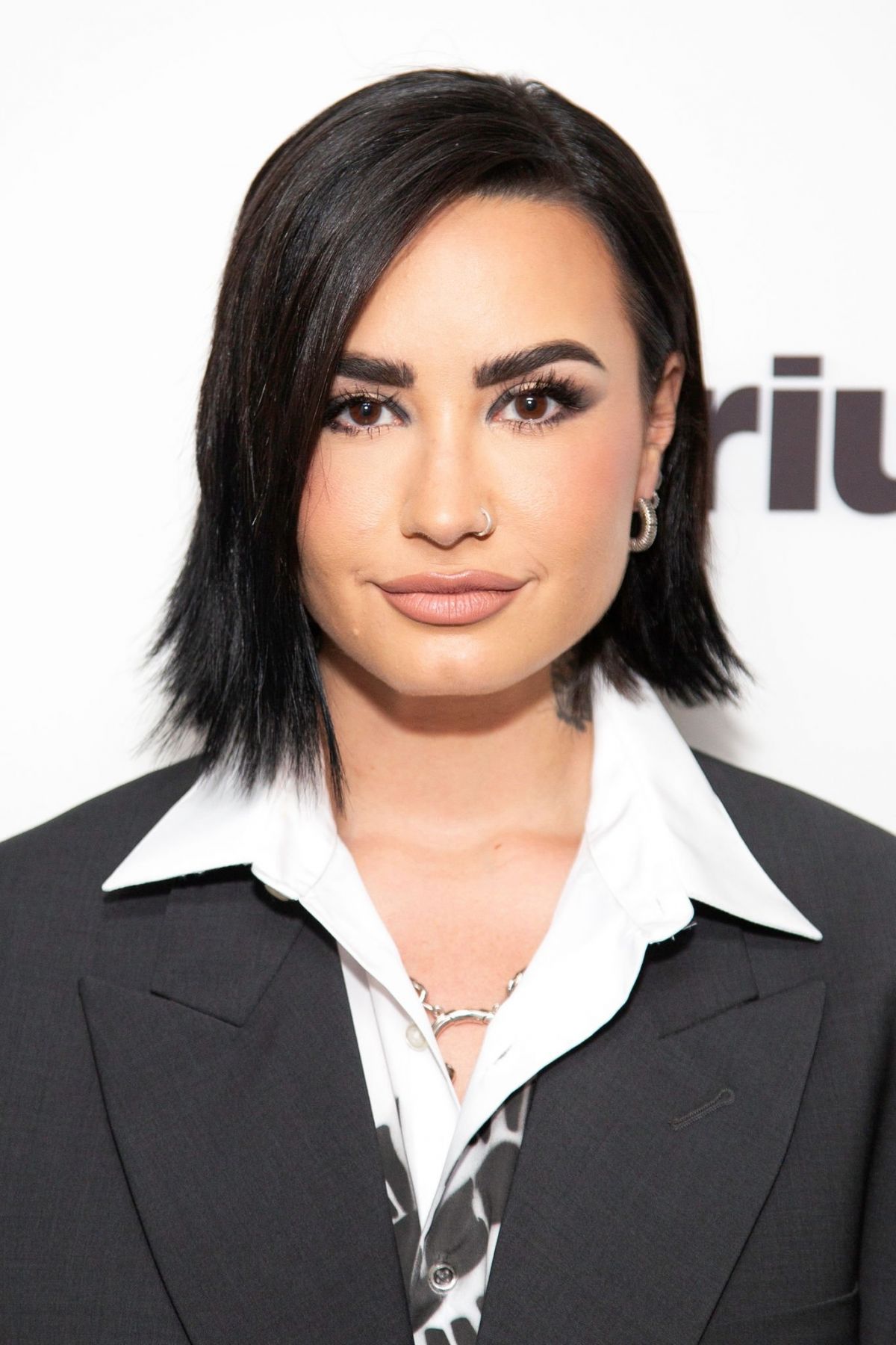 Demi Lovato rocks stylish suit pants at SiriusXM Studios 07/14/2023