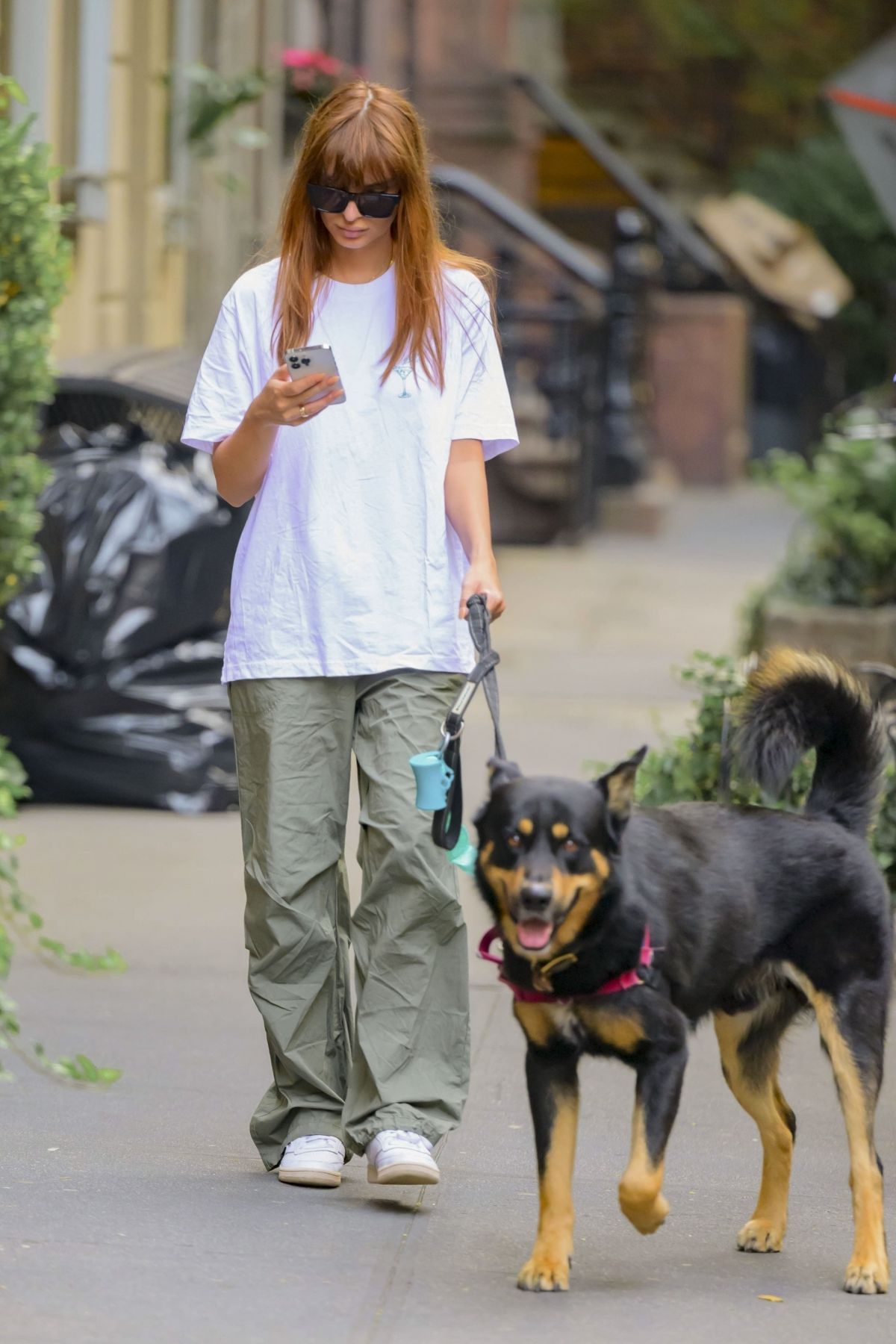 Emily Ratajkowski walks her dog out in New York