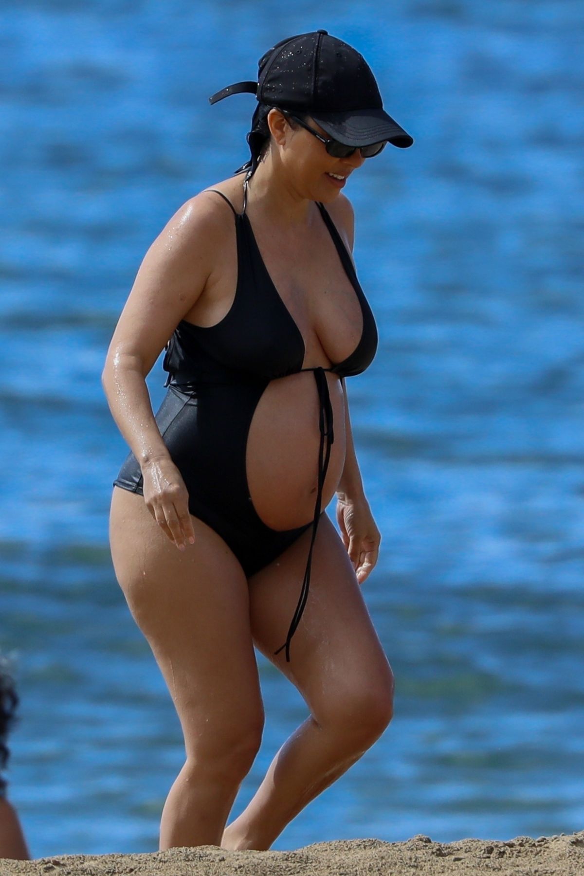 Kourtney Kardashian Flaunts Baby Bump in a Black Swimsuit during Beach Getaway in Kauai, Hawaii