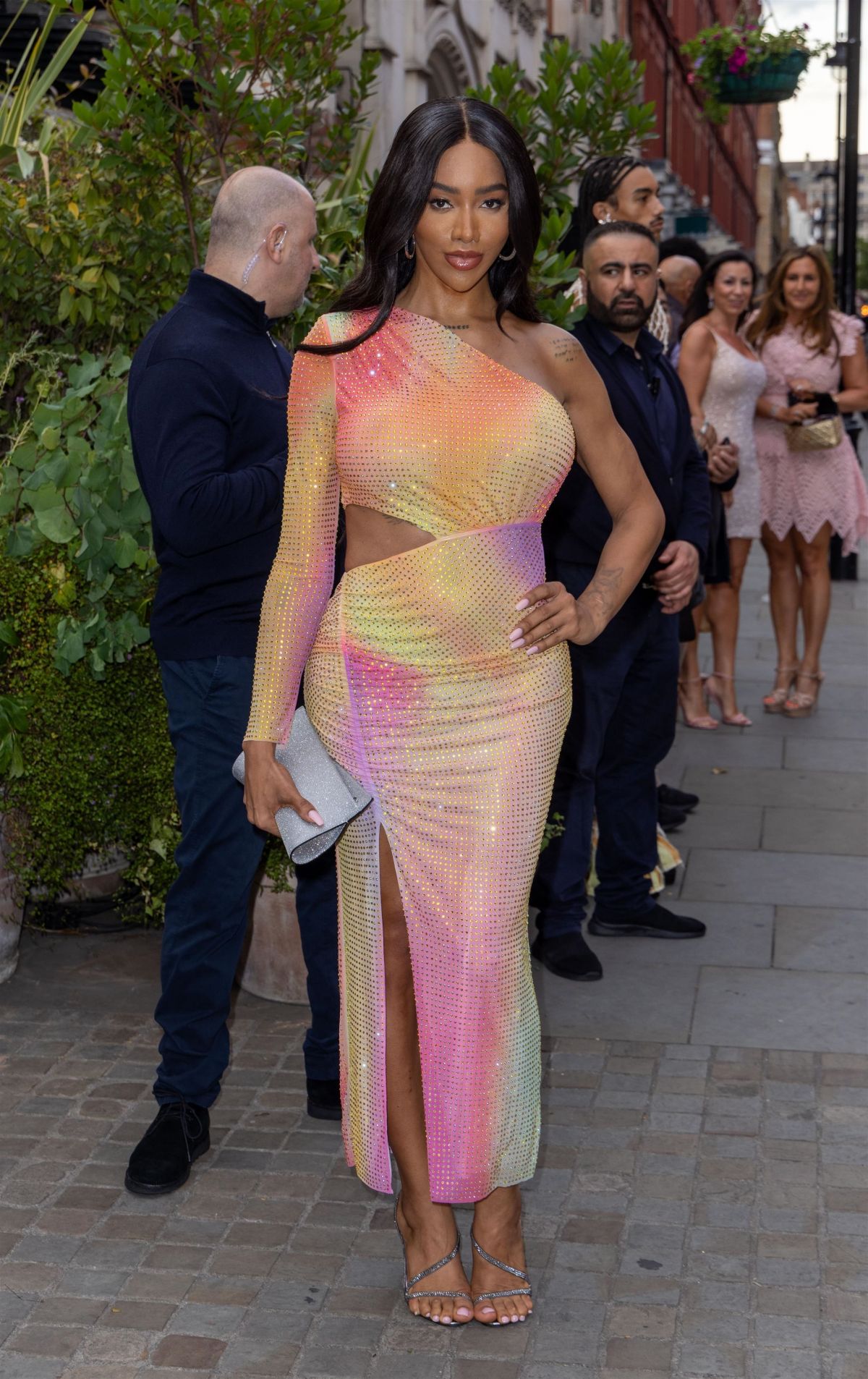 Munroe Bergdorf Rocks a Colorful Dress and Strikes Poses at British Vogue Party in London 07/13/2023