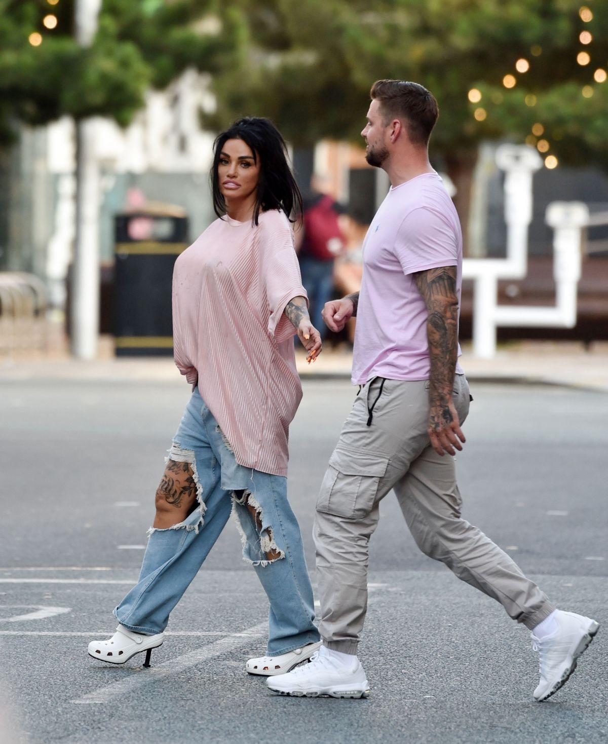 Katie Price Climbs onto a Vivid Pink Car in Liverpool 09/04/2023