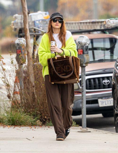Ashlee Simpson in a green cardigan and brown trousers in Los Angeles