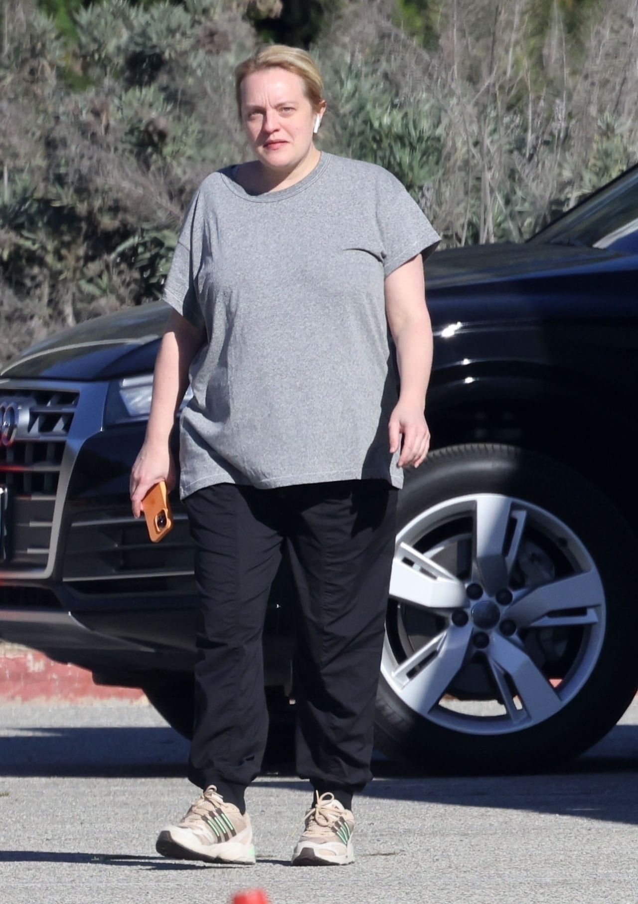 Elisabeth Moss in grey tee and black bottoms in LA