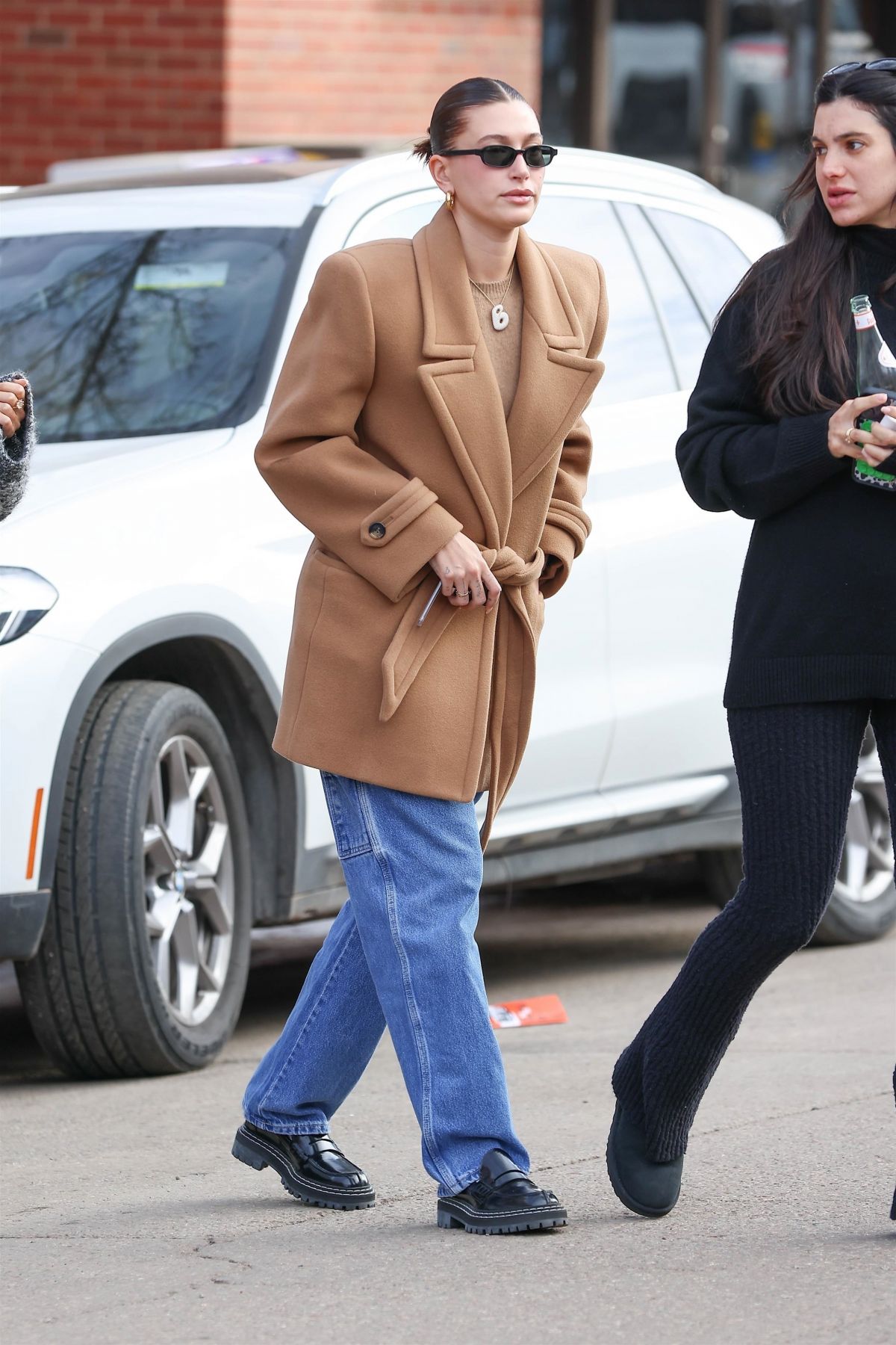 Hailey Bieber in Aspen Breakfast Look: Long Brown Jacket & Denim Style 2