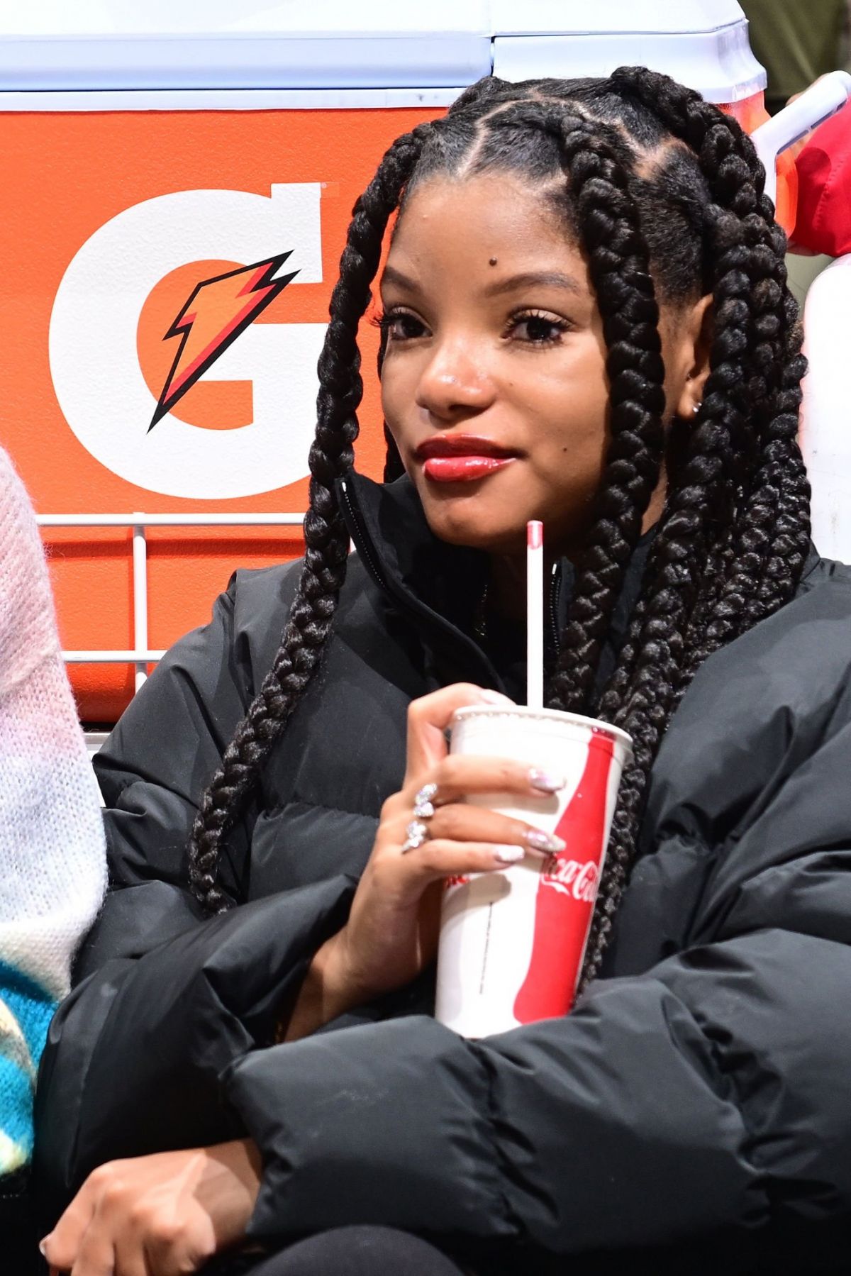 Halle Bailey in Black Puffer at Clippers vs Warriors Game LA