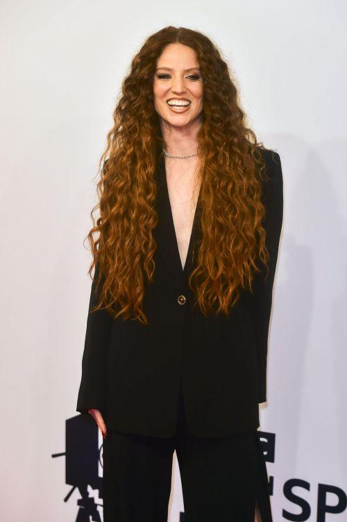 Elegant individual in black attire at a prestigious sports personality event.