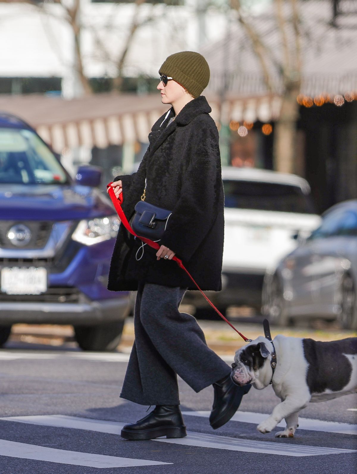 Julia Garner walking her bulldog