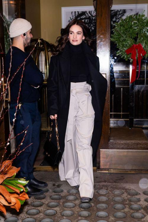 Lily James in black overcoat leaving NYC hotel 2