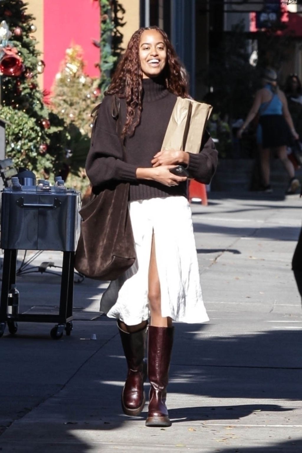 Malia Obama Stylish Brown Sweater and Boots Ensemble in Los Angeles
