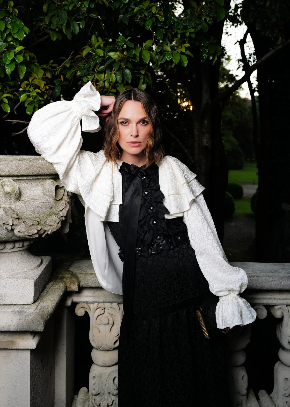 Keira Knightley posing in a white textured blouse and black dress during her May 2025 Vanity Fair photoshoot Keira Knightley posing in a white textured blouse and black dress during her May 2025 Vanity Fair photoshoot