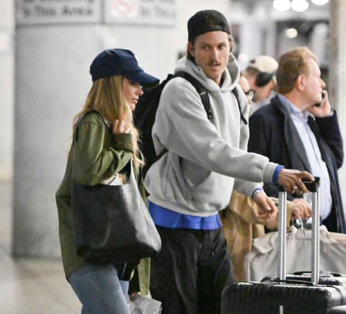 Margot Robbie with Cameron Land JFK, September 2025 1